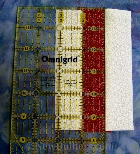 Photo of ruler measuring fabric strip sets