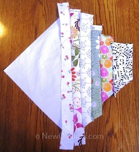 Photo of string quilt block with half the fabric strips added