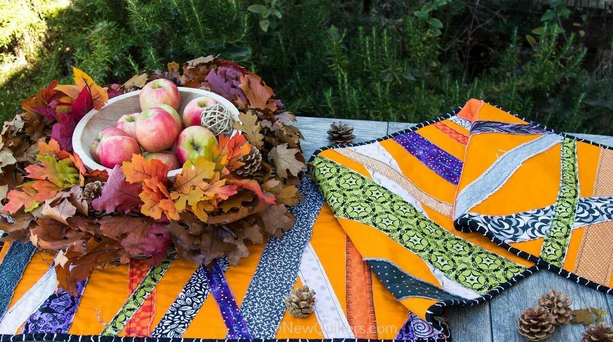 Get inspired to make a quick and easy Halloween table runner with this gallery of photos from the one we made. NewQuilters.com #halloweenquilt, #tablerunnerquilt, #tabletopperquilt