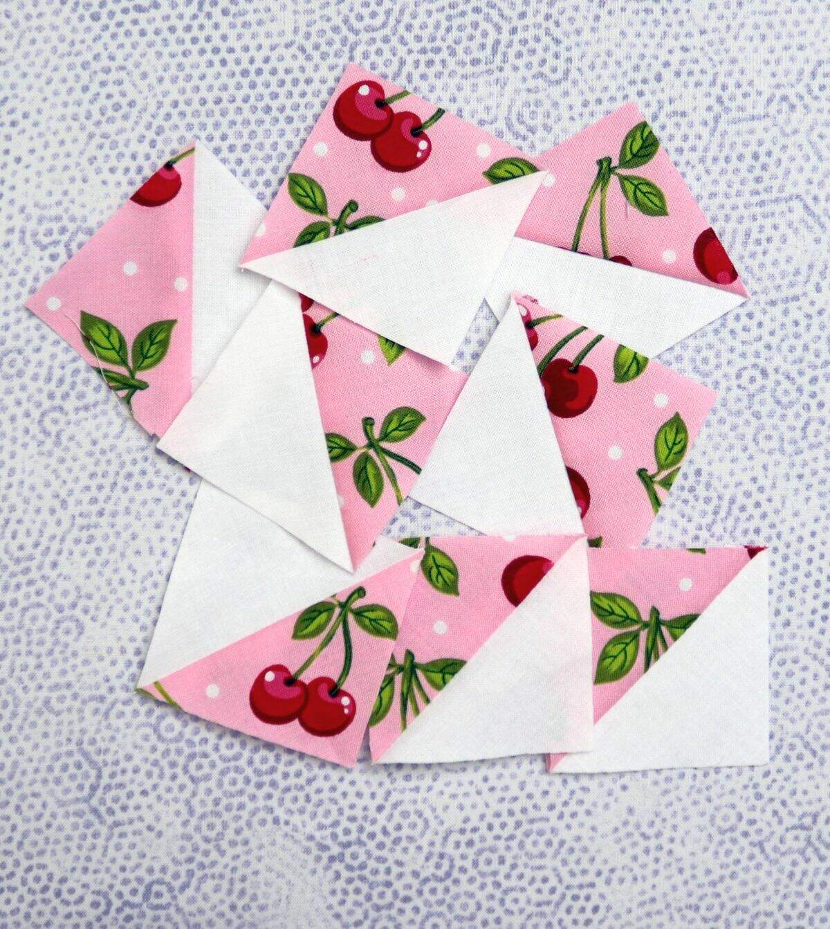 Half square triangles pink white cherry fabric