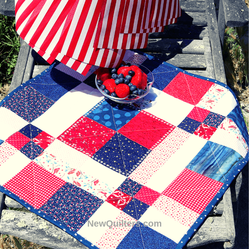 "Disappearing 9 Patch Table Topper Tutorial” is a Free Patriotic Quilted Table Top Pattern designed by Christine Mann from New Quilters!