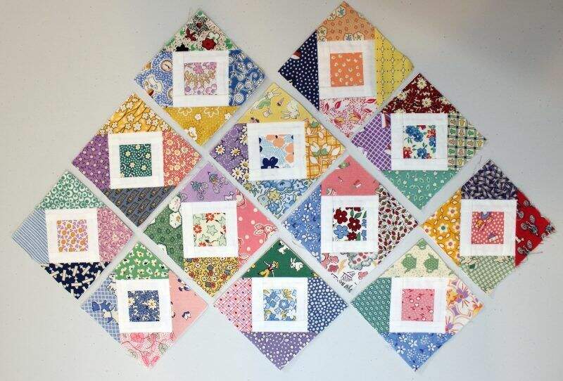 Photo of 1930s reproduction paper pieced quilt blocks